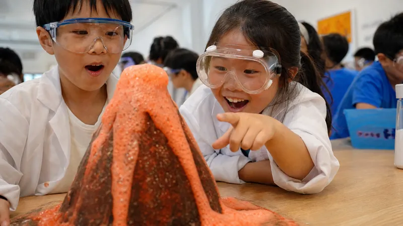 A child erupting a fizzing volcano at camp