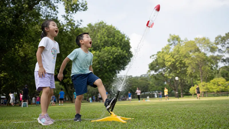 Children launching a water bottle rocket at camp